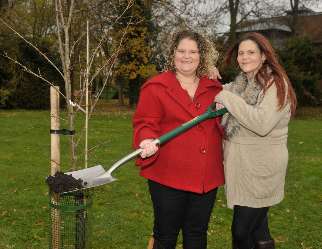 Louise and Natalie Brown planting a tree at Bourn Hall
