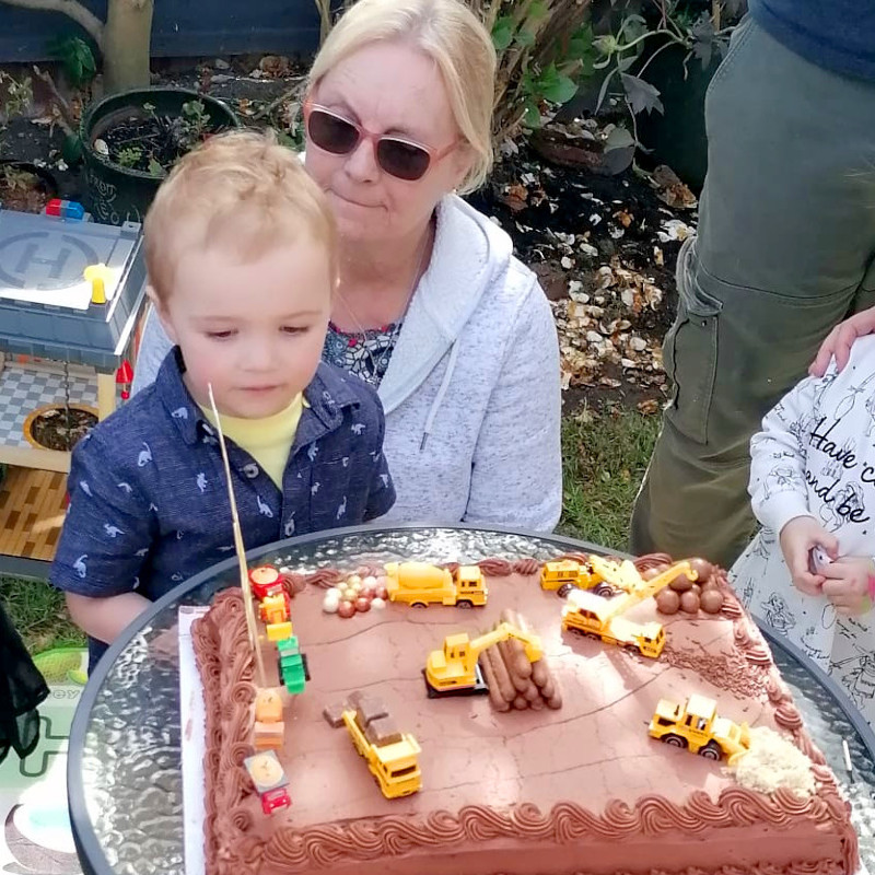 Bear and his grandmother with his birthday cake