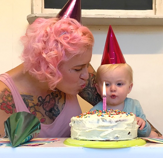 Laura and Agatha blow birthday candles out