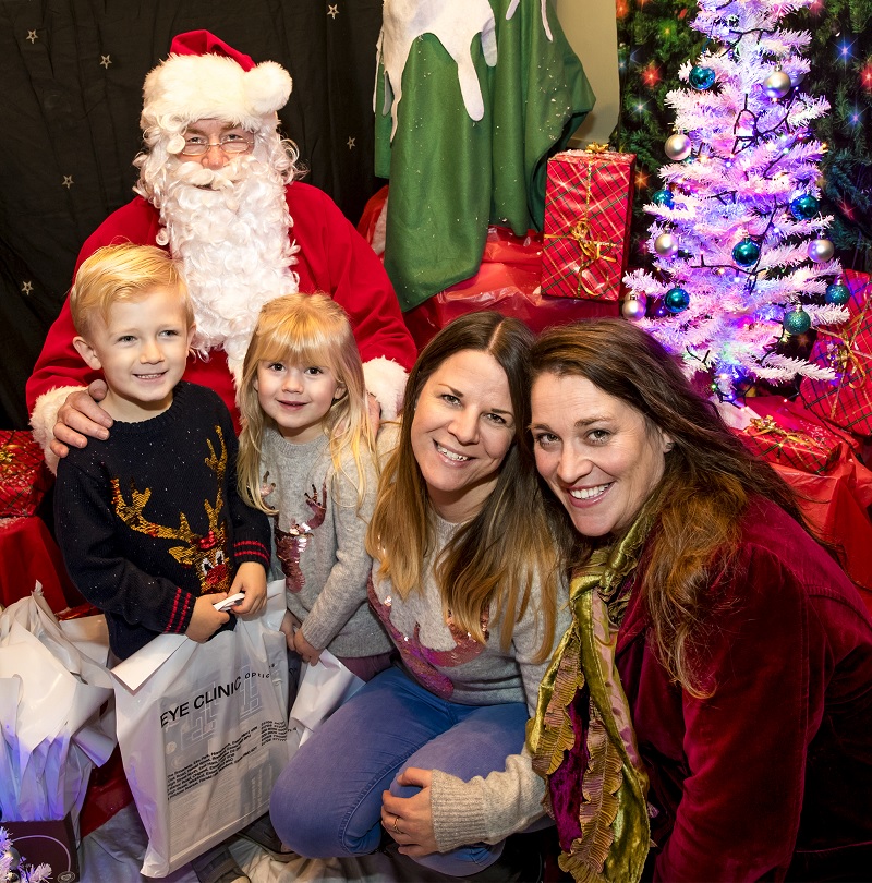 William and Evelyn Woods with Father Christmas accompanied by their mum Vicki (centre) and Bourn Hall fertility nurse Angela Leach